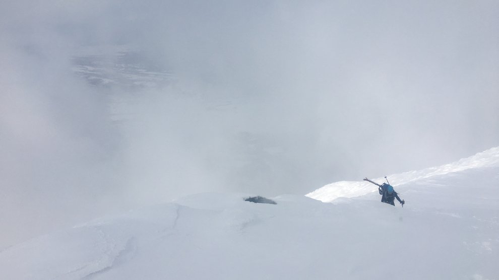 Ben skiing over the rim.