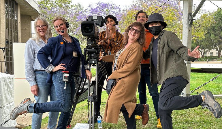AMT group photo with camera when setting up for Commencement 2023