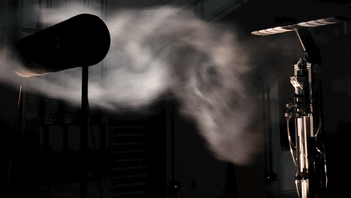 Machine learning for flow-informed aerodynamic control in turbulent wind conditions