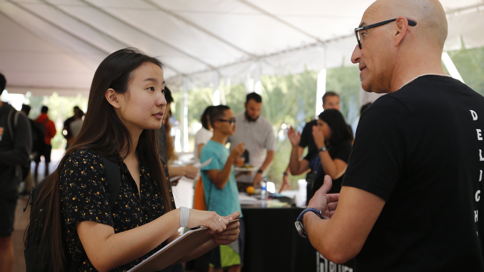 CMS-EE Partner company representative talking to student