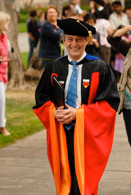 Image of Caltech faculty member at commencement.