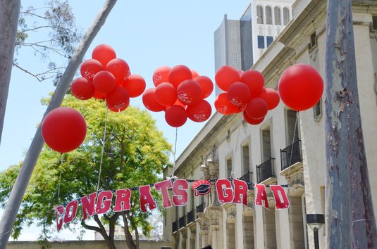 balloons and congratulations banner near Parsons-Gates Hall of Administration