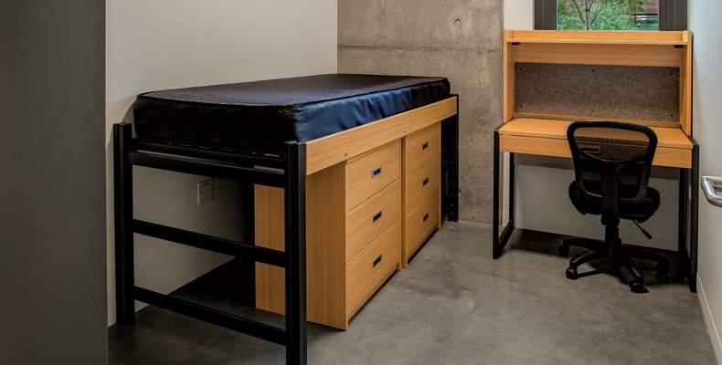 Single occupant, with small desk, bed and cabinets for the student rooms