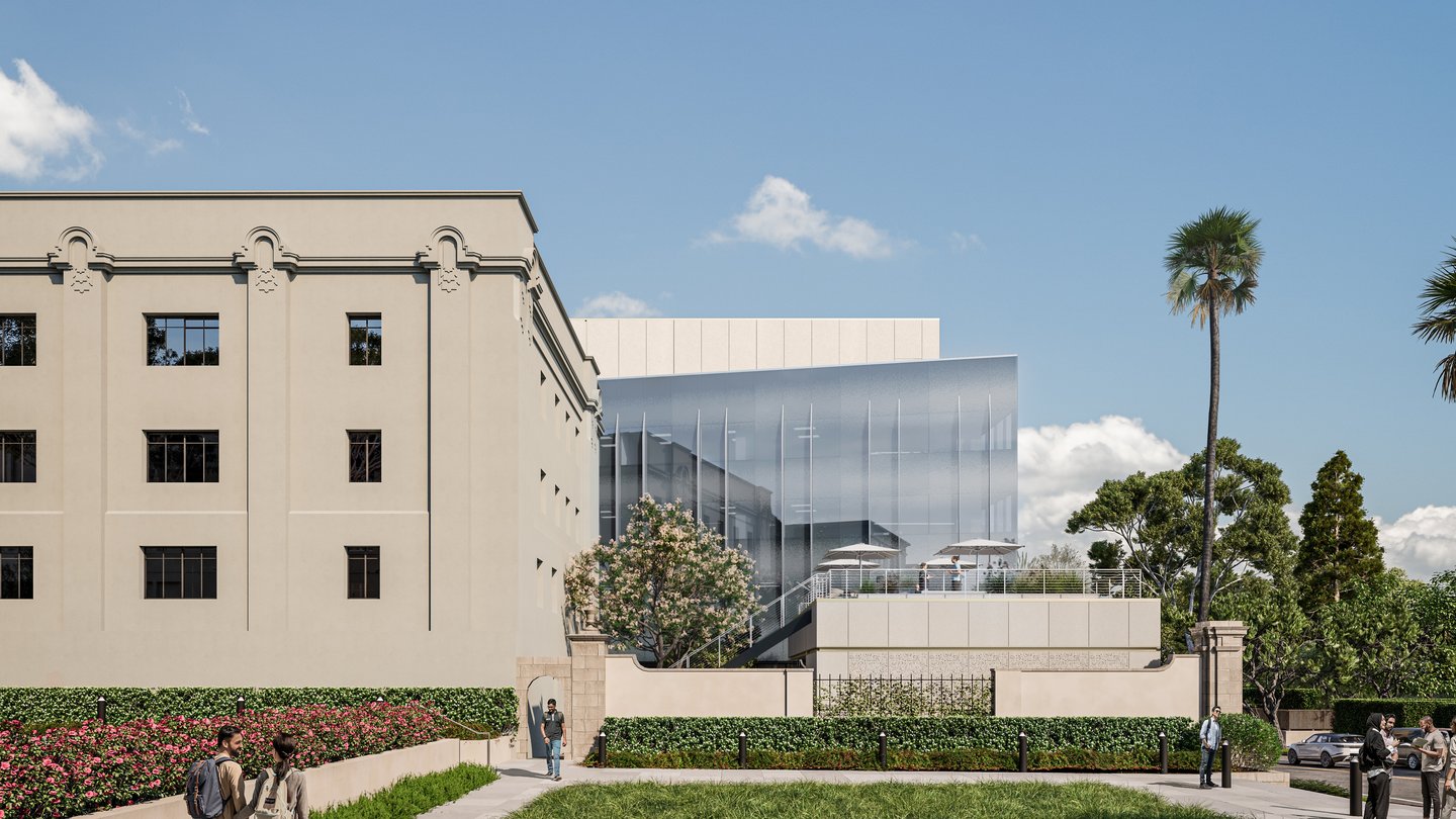 glass building in distance. green lawn in foreground.