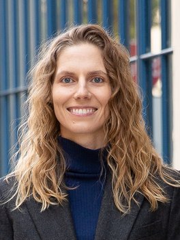 woman with blond hair in black turtleneck sweater