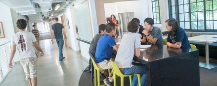 Student at a table in Gates-Thomas building.