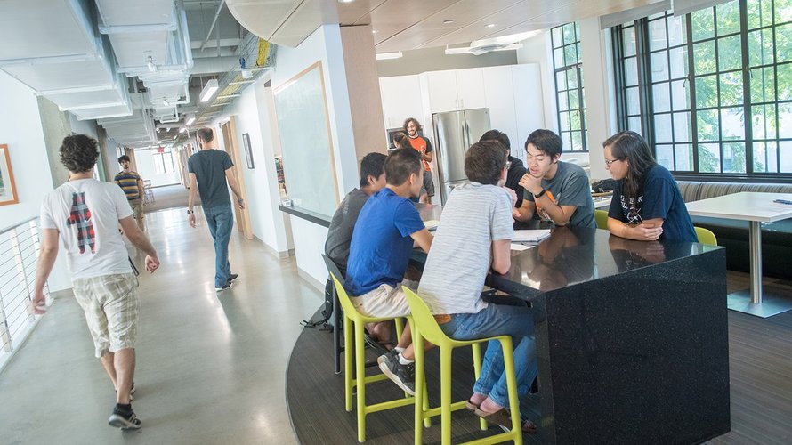 Student at a table in Gates-Thomas building.