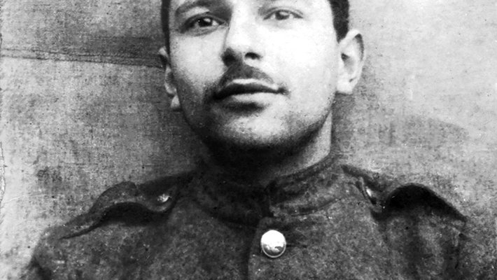 Student ID photo, head and shoulders portrait of young Mathisson, wearing soldier's garb.
