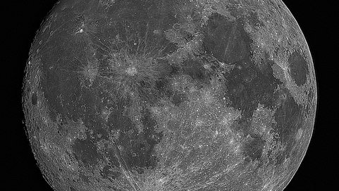 Black and white image of near full moon taken in Jackson Hole Wyoming using a Planewave 12.5" telescope and a Canon 5D Mk4 camera. It is made from 100 separate images that were stacked to produce a low noise and high resolution image.