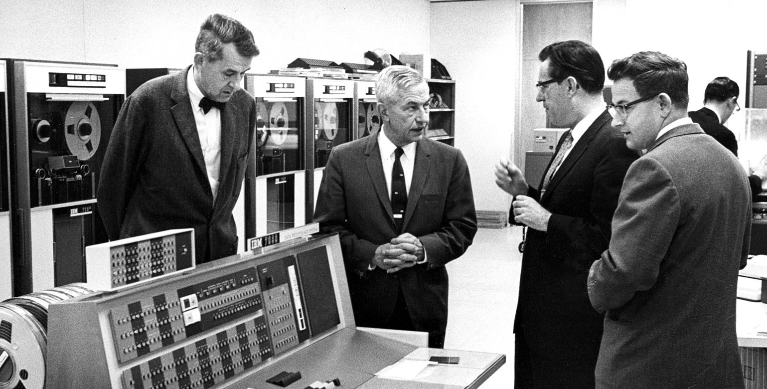 Frederick Lindvall, Lee DuBridge, Gilbert McCann, and Kendrick Hebert in the Willis H. Booth Computing Center