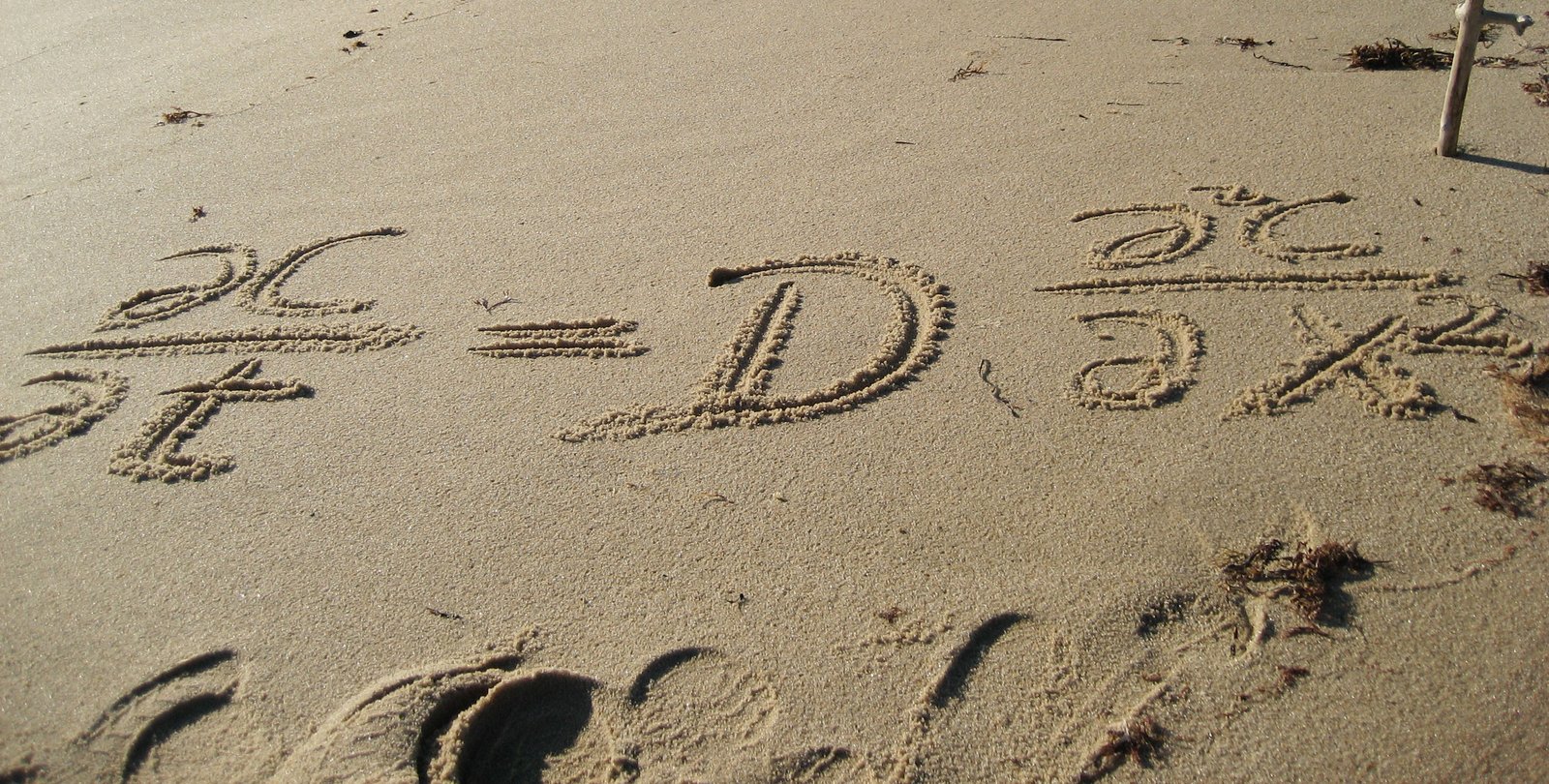Equation written in the sand