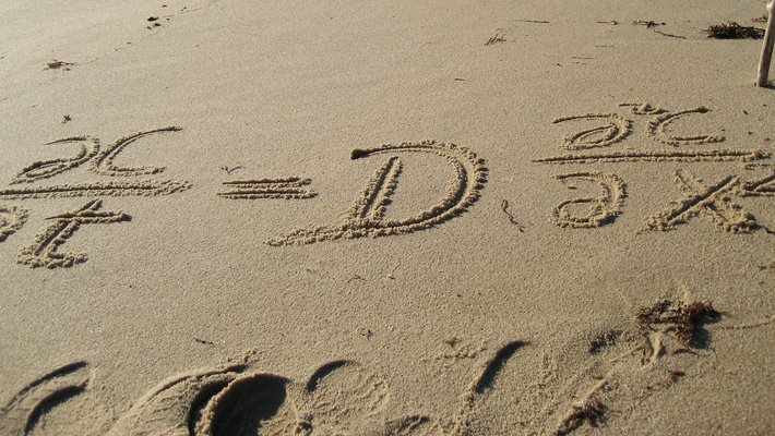 Equation written in the sand