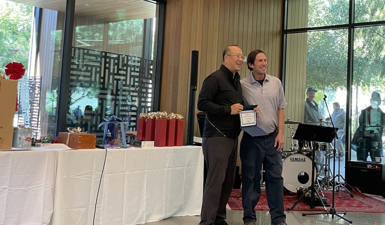 Ryan Robitaille receiving Excellence in Leadership / Mentorship Award