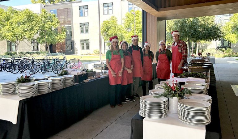 Banquet Tables with 6 people in red aprons