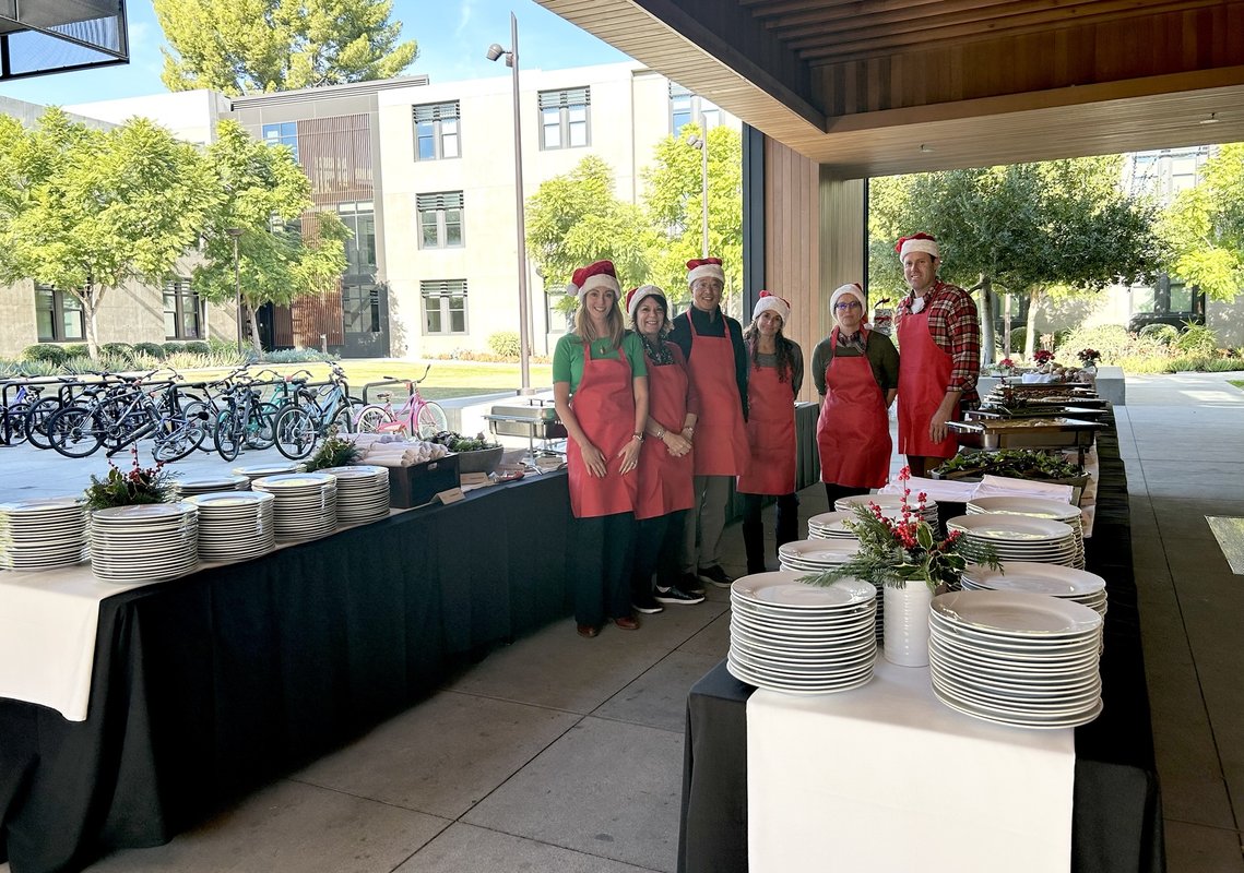 Banquet Tables with 6 people in red aprons