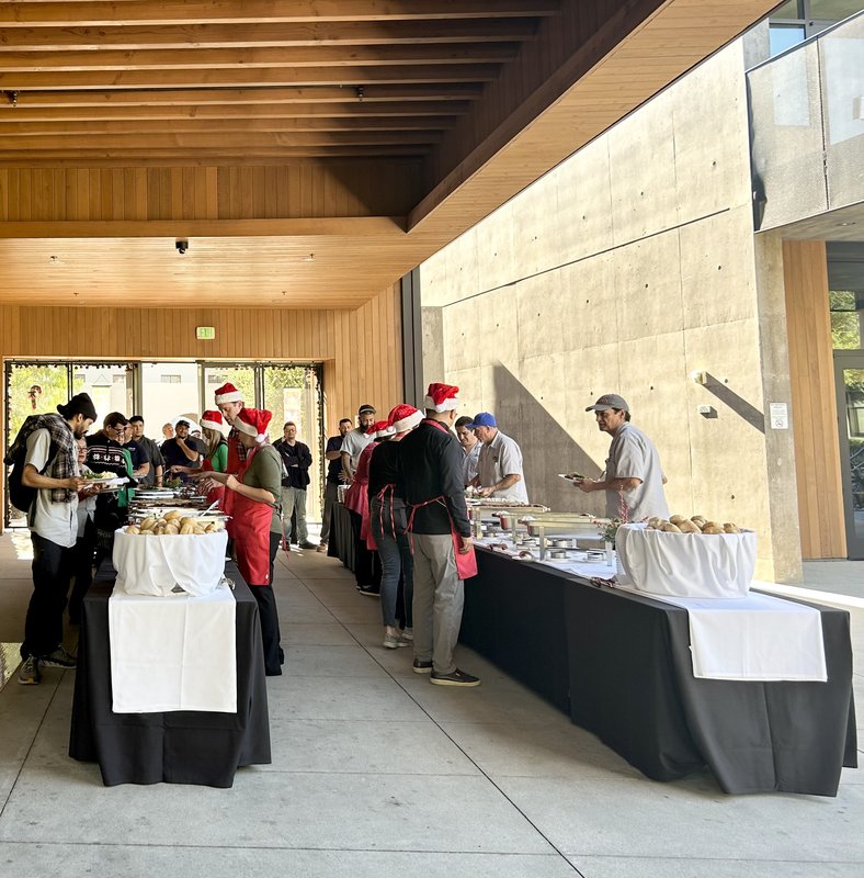 Banquet tables with managers serving and employees receiving