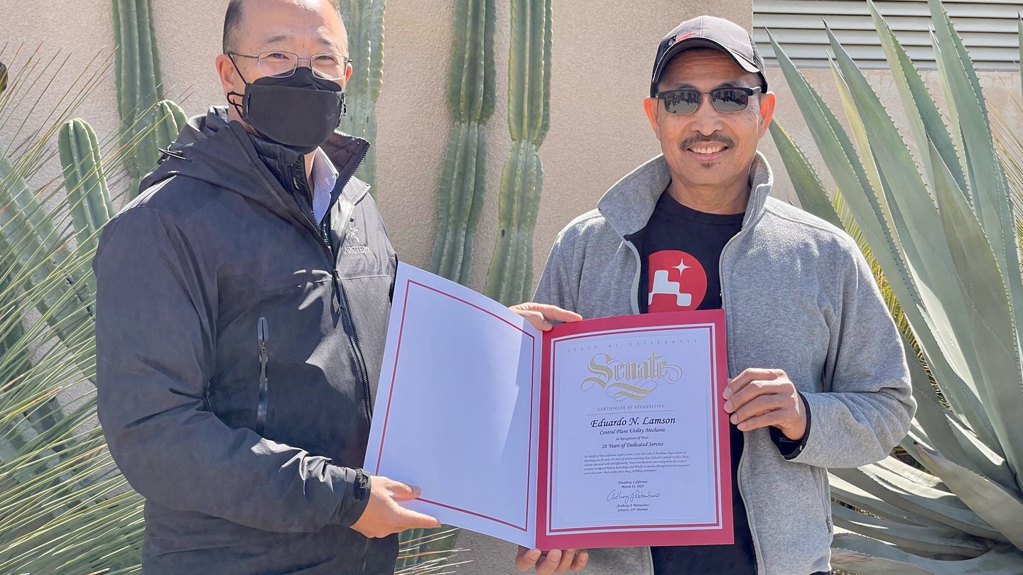 Ed Lamson and Dave Kang. Dave is presenting Ed with a certificate of recognition for his years of service from the California Senate