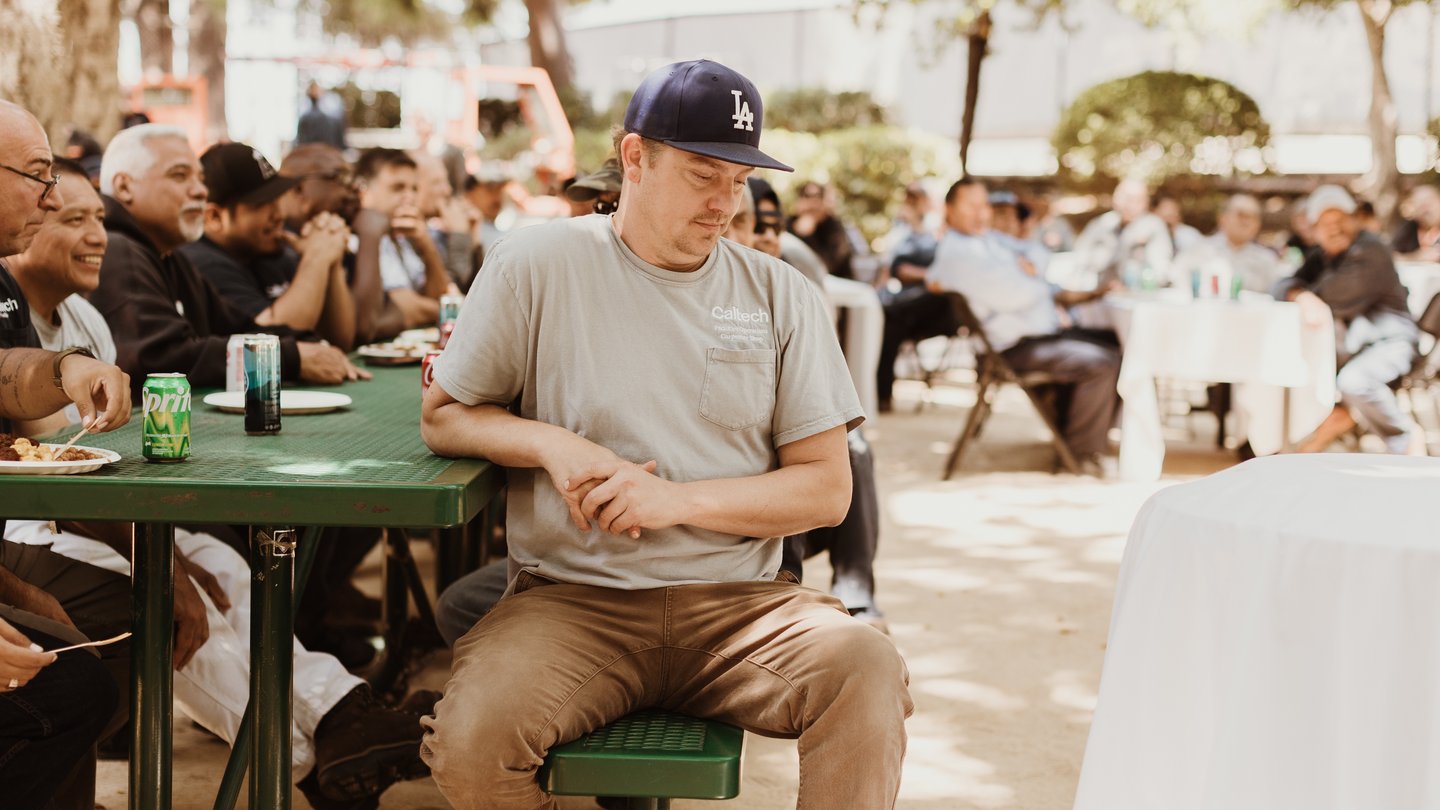 Adam Gallasch of the Carpenter Shop enjoys the 2023 Summer BBQ