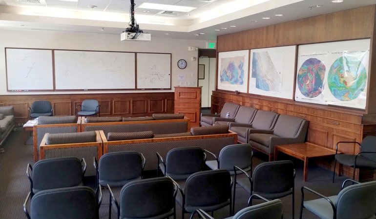 Benioff Room is a large conference room with wood paneling.