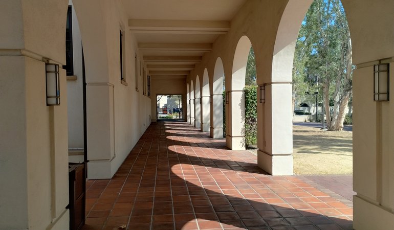 An arched walkway in an outdoor area
