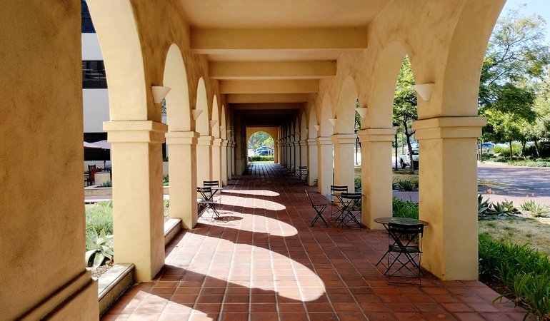 An arched walkway in an outdoor area