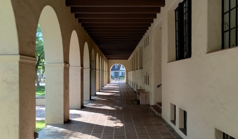 An arched walkway in an outdoor area