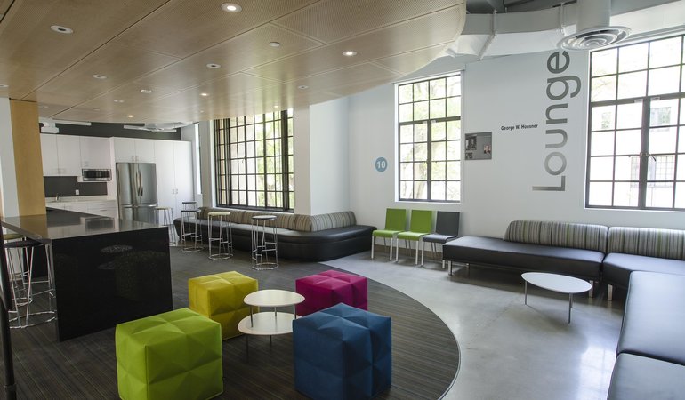 A lounge area with plush and colorful seating areas