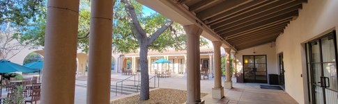 view of Avery Exterior Courtyard Breezeway with its multiple columns and trees in the couryard