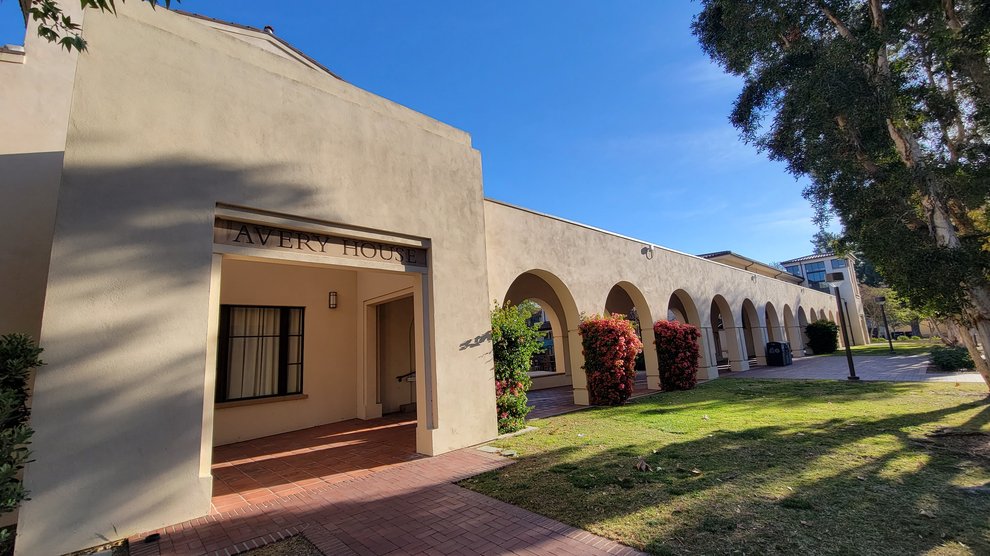 view of the Avery West Exterior Entrance with sunshine hitting the breezeway leading to the entrance