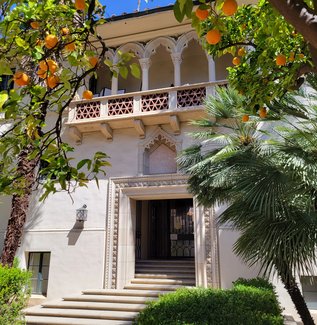 entrance to the Dabney House flanked by large orange trees
