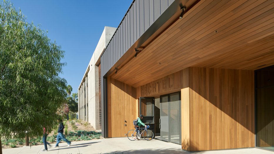 Exterior of Bechtel Residence with people entering and exiting main entrance.