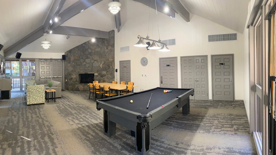Inside the Catalina Rec Room featuring table, fireplace, and pool table.