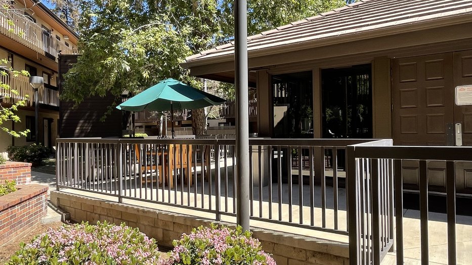 Catalina Outdoor Space featuring tables and foliage.