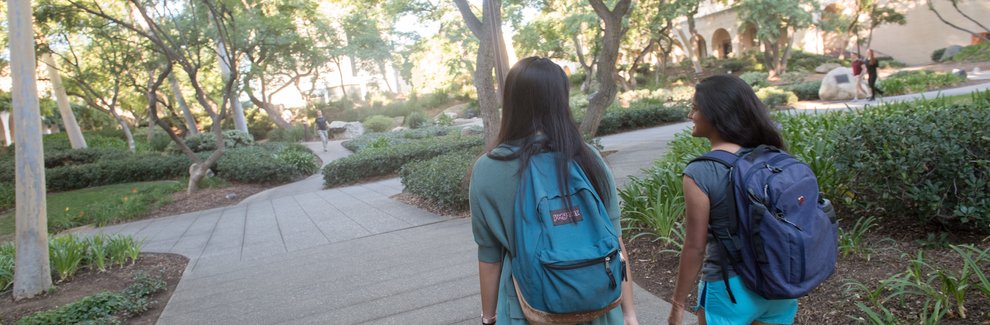 Students walking outside on campus