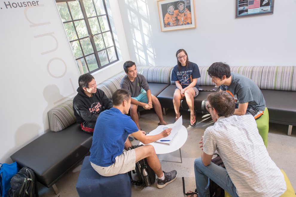 Students talking in a lounge area.