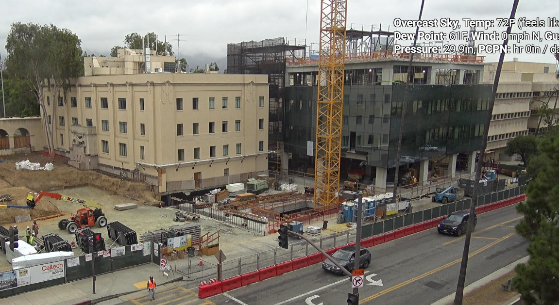 Progress of the Ginsburg Center construction, focusing on the installation of the glass curtain wall.