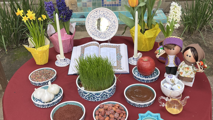 Haft-seen table covered in bowls of foods and spices