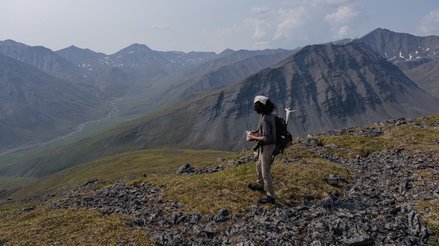 Isaac hiking in the rugged Arctic terrain of the Alaskan Brooks Range