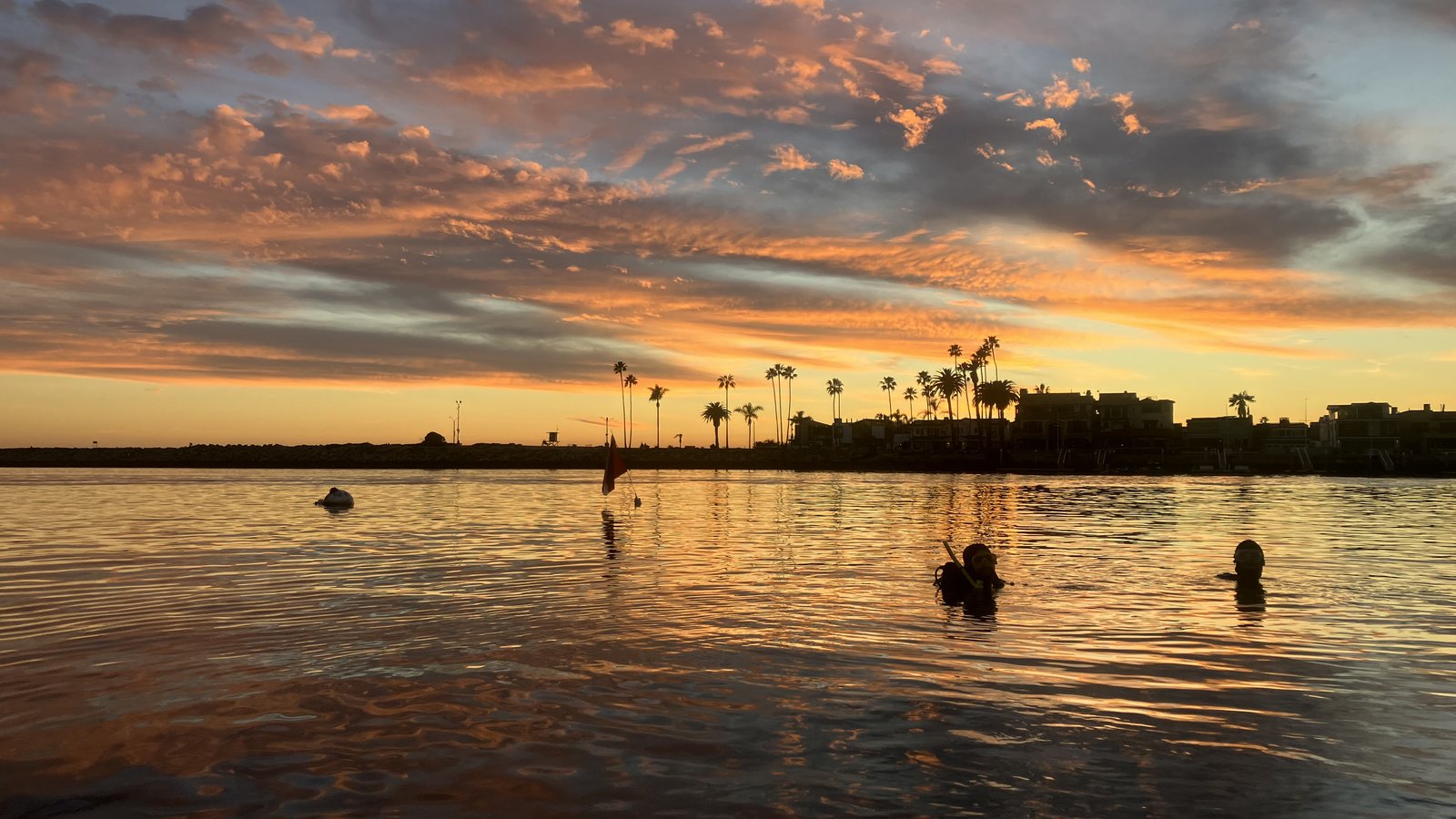 divers at sunset