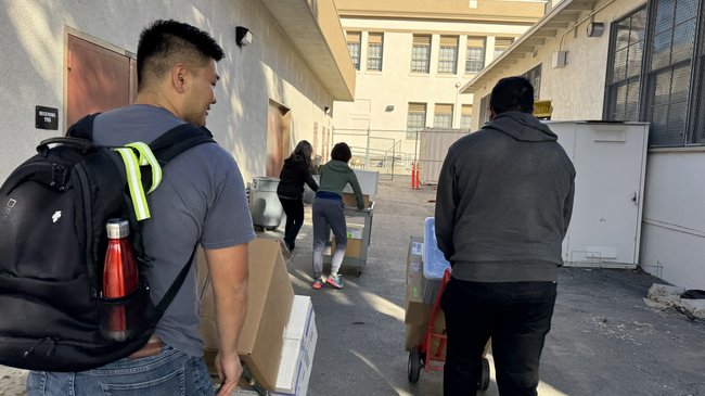 LEAP team moving boxes