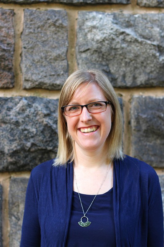 A smiling woman looking into the camera