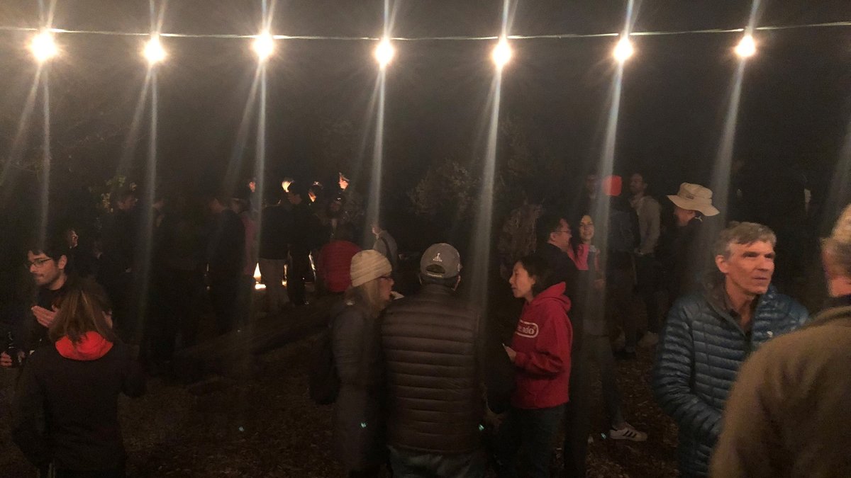 People chatting at the bonfire