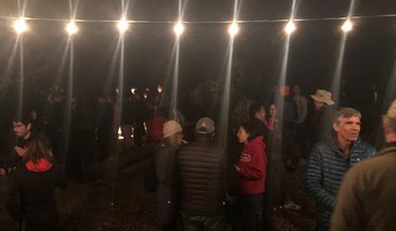 People chatting at the bonfire