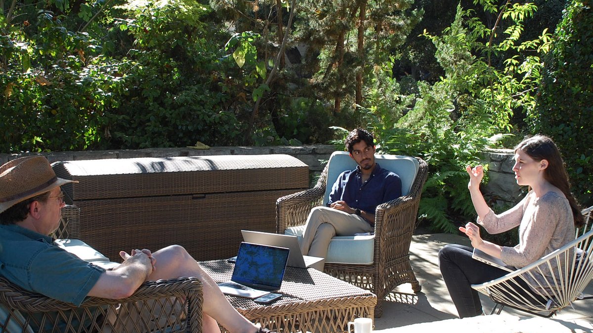 Davide Anderson (left), Adi Nair (center) and Ann Kennedy (right) sitting on a shaded patio