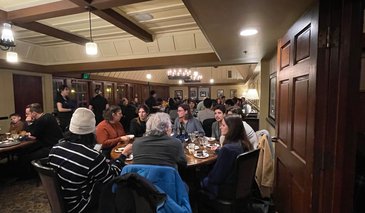 People having dinner in hotel dining room