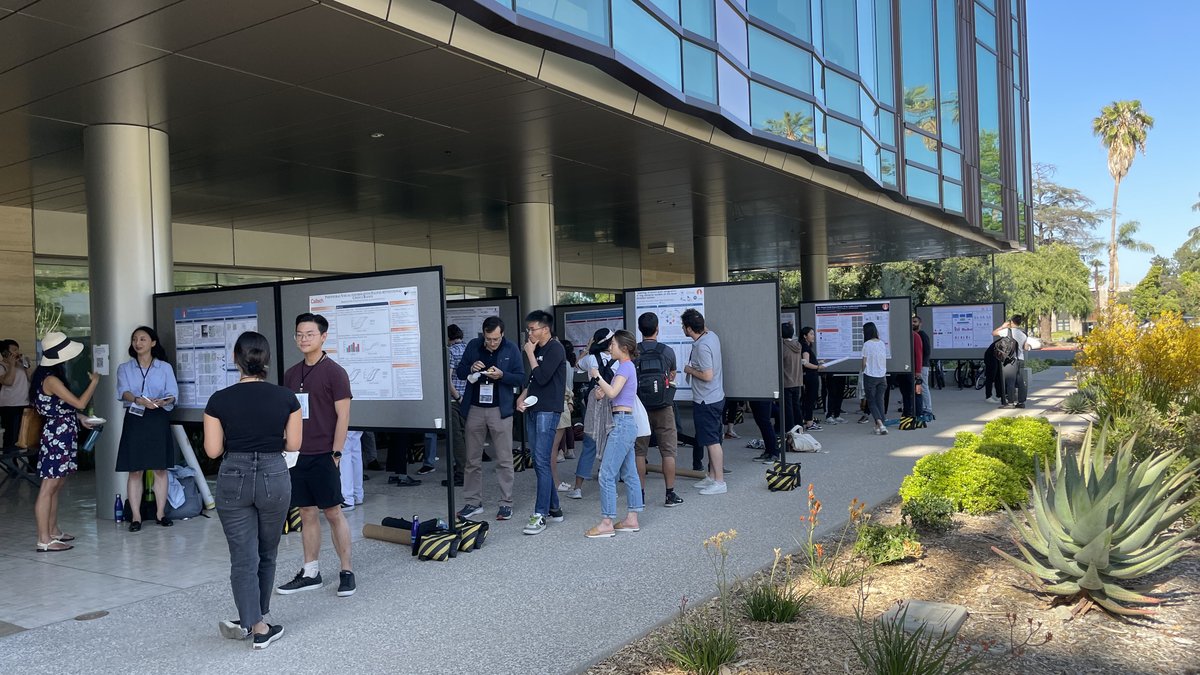 Poster Session with people in the portico of a modern style building