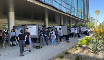 Poster Session with people in the portico of a modern style building
