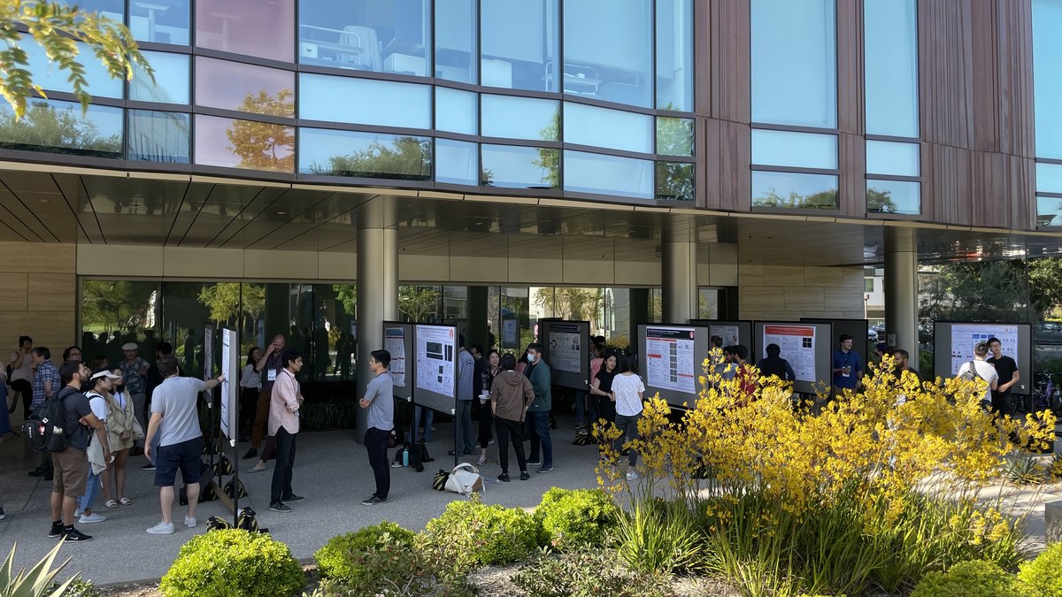 Poster session set up outside with a garden area in the foreground