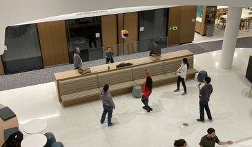 People playing volleyball with a beach ball inside