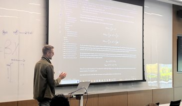 Max Melin teaching in modern classroom
